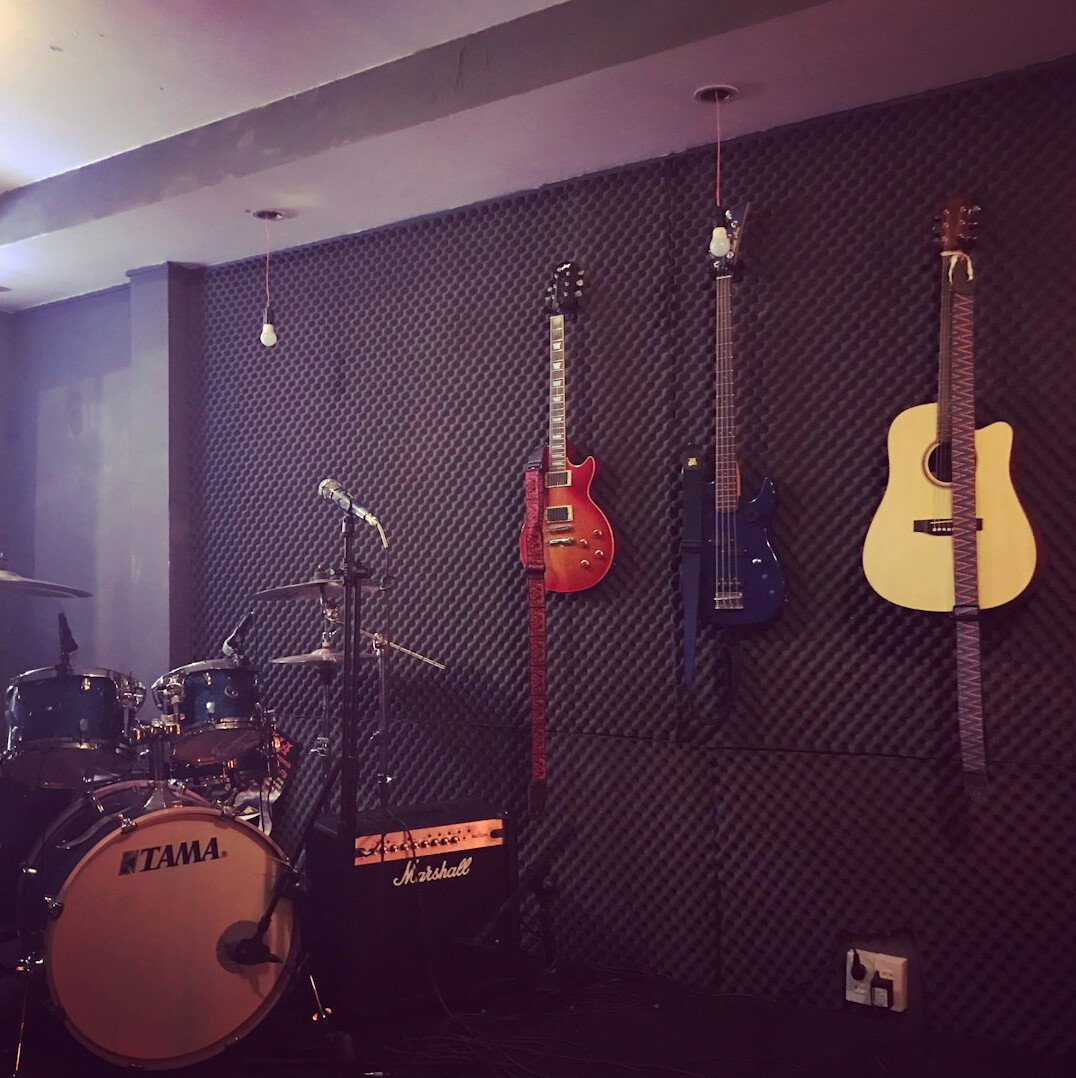 Recording studio with microphones and acoustic panels